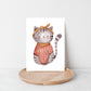 Karte Katze Vintage A6: Aquarell einer Katze mit Pullover und Schleife, auf Holzplatte. Handgefertigt auf 300g Naturpapier, ideal als Grußkarte.