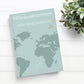 Reisetagebuch Glücksabenteuer A5 Hardcover: Notizbuch mit einer Weltkarte und Papierfliegern auf dem Cover, ideal zum Planen und Festhalten von Reiseerinnerungen.