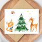 Weihnachtskarte Reh & Fuchs A6 mit Aquarellillustrationen von einem Baum, Fuchs und Reh auf hochwertigem Naturpapier, perfekt für Weihnachtsgrüße.