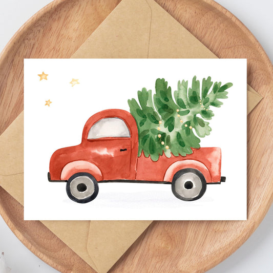 Weihnachtskarte Auto & Weihnachtsbaum A6: Aquarell eines roten LKWs mit einem Weihnachtsbaum auf dem Dach. Hochwertiges, mattes Naturpapier.