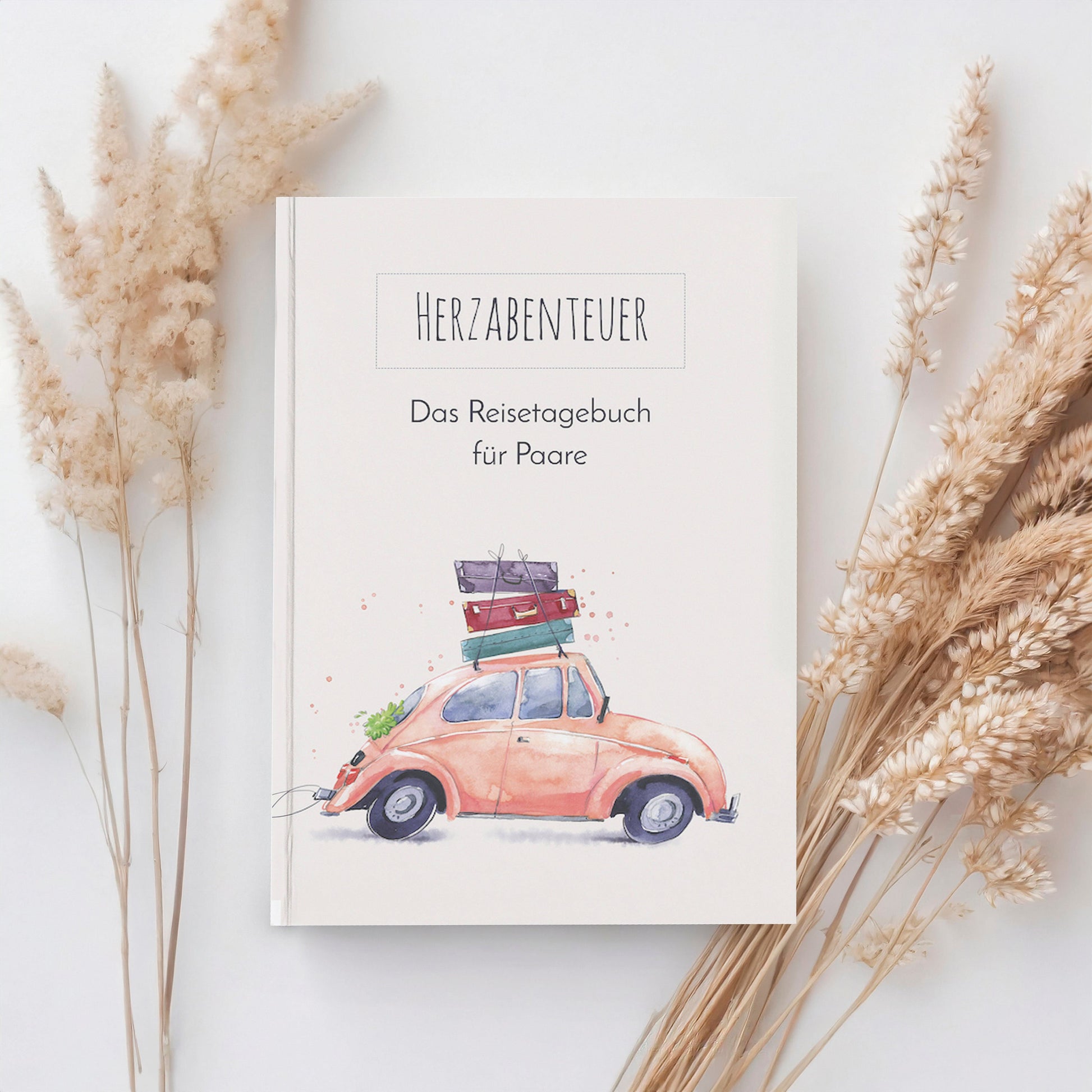 Reisetagebuch für Paare A5 Hardcover Honeymoon mit einem rosa Auto und Koffern auf dem Cover, ideal zum Planen und Festhalten von Reiseerinnerungen.