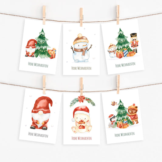 Weihnachtskarten-Set 6 Karten Weihnachtszauber Frohe Weihnachten A6: Sechs liebevoll illustrierte Karten mit Weihnachtsmotiven wie Schneemann, Gnom, Hase und Baum, ideal für Weihnachtsgrüße.