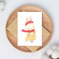 Weihnachtskarten-Set 6 Karten Winter A6: Handgefertigte Karte mit weihnachtlichen Illustrationen von Hase mit Hut und Schal, auf hochwertigem Naturpapier.