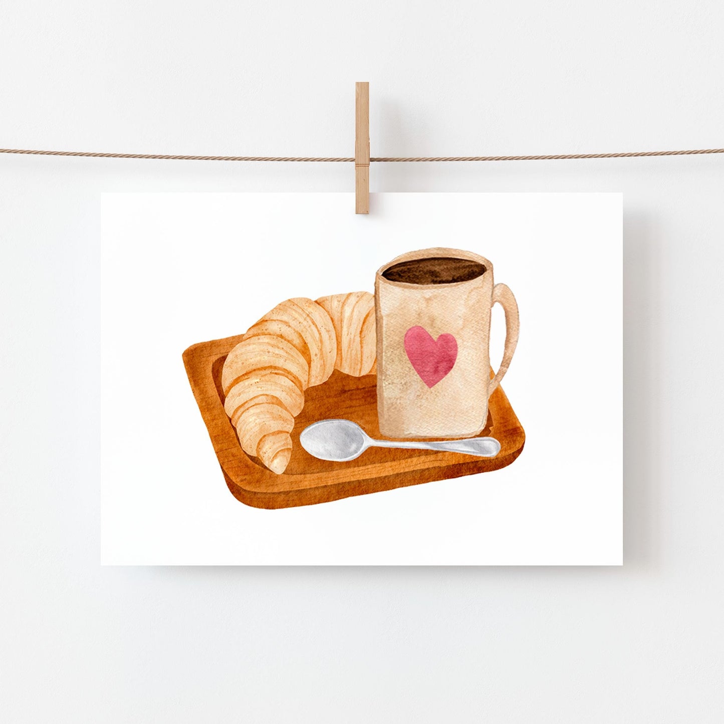 Postkarte Frühstück A6 zeigt ein Croissant und eine Kaffeetasse mit Herzmotiv, ideal als Einladungskarte oder Grußkarte für Kaffeeliebhaber.